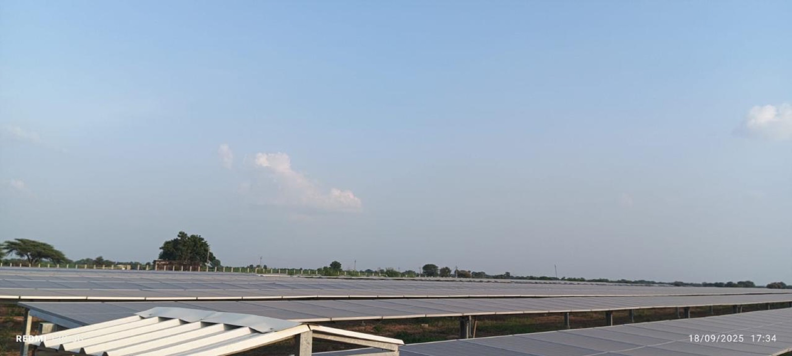 A wide panorama of the commissioned module field beneath an open sky.